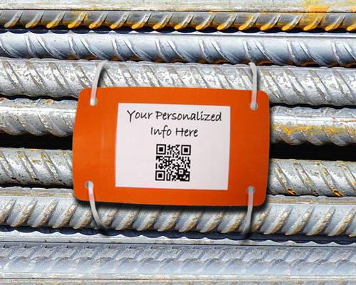An image of an orange inventory management tag, or bundling tag, with a qr code and the message, "your personalized information here" shown wrapped around pieces of metal rebar.