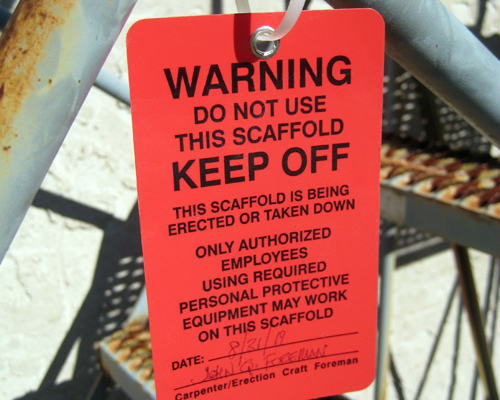 An image of a red warning tag rading, "Warning, Do not use this scaffold".