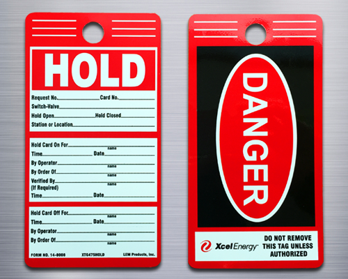 A rectangular tag saying, "Hold" on one side and "Danger" on the other.