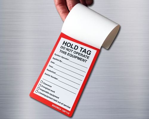 A rectangular tag with a self laminating cover