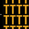 An image of a sheet of 16 retroreflective high intensity prismatic numbers & letters sized to fit in a 3-ring binder. Charaters are orange on a black background. The legend is, "T".