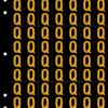 An image of a sheet of 70 retroreflective high intensity prismatic numbers & letters sized to fit in a 3-ring binder. Characters are orange on a black background. The legend is, "Q".