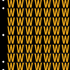 An image of a sheet of 70 retroreflective high intensity prismatic numbers & letters sized to fit in a 3-ring binder. Characters are orange on a black background. The legend is, "W".