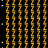 An image of a sheet of 70 retroreflective high intensity prismatic numbers & letters sized to fit in a 3-ring binder. Characters are orange on a black background. The legend is, "Z".