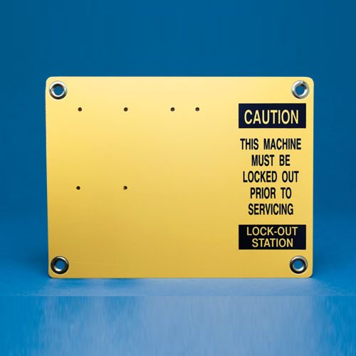 A lockout station board in Yellow with Black text reading, "Caution, this machine must be locked out prior to servicing. Lockout Station".