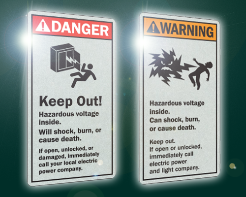 Reflective transformer labels with danger and warning headings are used on electrical transformers to warn of dangerously high voltage.