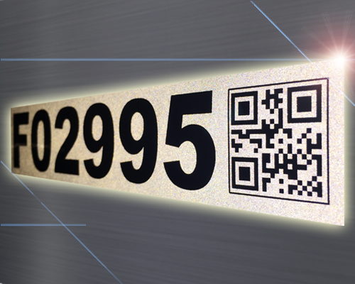 A reflective utility equipment label with sequential numbering and a QR code.